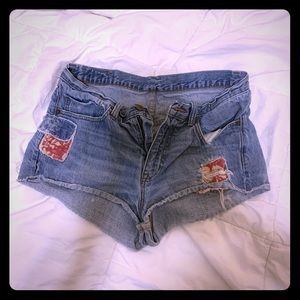 Very short ripped denim shorts.
